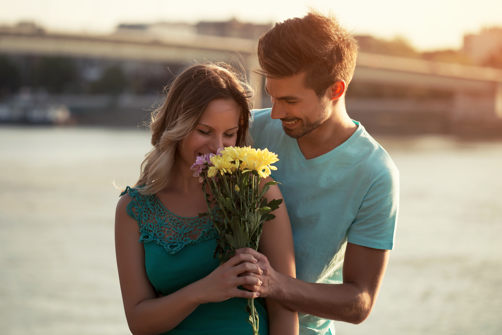 Man giving flowers to his girlfriend